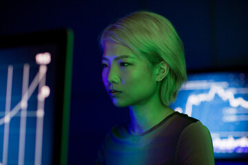 Asian female financial trader in futuristic style