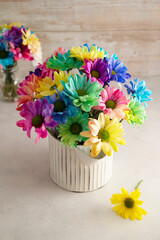 Rainbow Chrysanthemum flower bouquets in glass vase. Greeting card, abstract floral background.