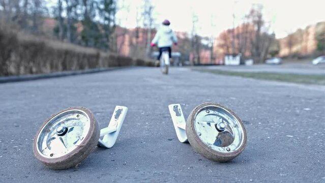 Young Kid Learning To Ride a Bike without Support Stabilizer Wheels Left Behind