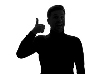 Silhouette of man showing thumbs up giving positive feedback,