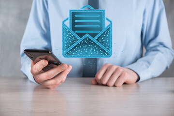 Businessman hand holding letter icon,email icons.Contact us by newsletter email and protect your...