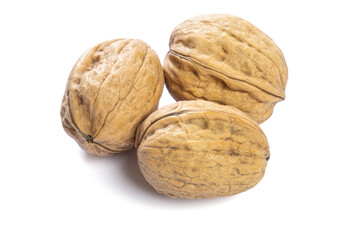 whole fresh walnuts on a white background