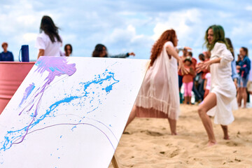 Drip painting outdoor art performance with dancing girls, creative workshop, art festival
