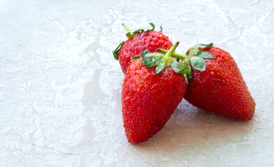 Fresh and Juicy beautiful organic strawberries on wooden background.Top view point.