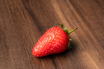 Fresh and Juicy beautiful organic strawberries on wooden background.Top view point.