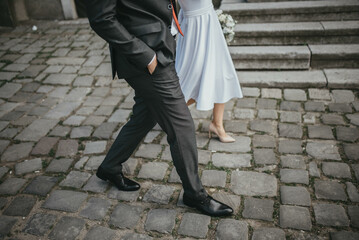 Wedding couple walking on road. Happy couple.