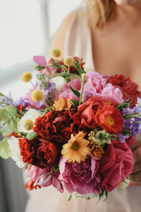 Bride holding a wedding bouquet. Rustic wedding bouquet.
