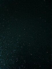 Abstract black and blue glitter background.