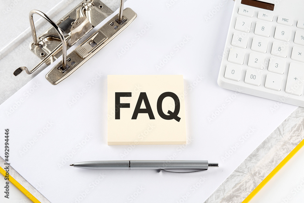 Poster faq - business concept, message on the sticker on folder background with calculator