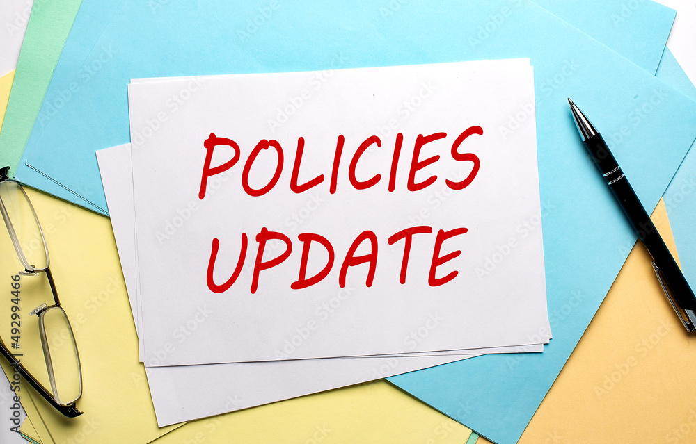 Poster policies update text on paper on the colorful paper background