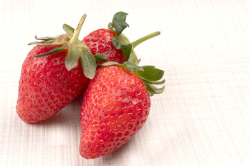 Fresh and Juicy beautiful organic strawberries on wooden background.Top view point.