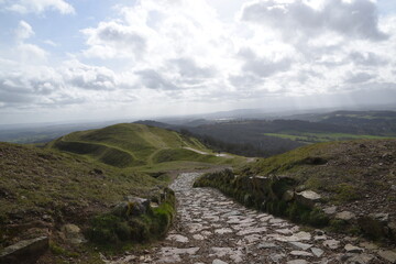 a path that leads down the hill at British camp in Malvern