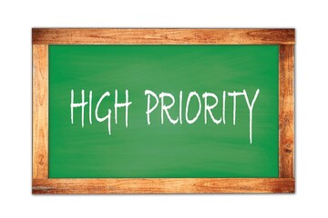 HIGH  PRIORITY text written on green school board.