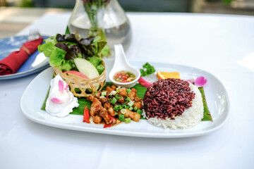 Stir-fried pork belly with garlic and chili, serve with rice and poached egg