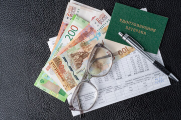 Russian money, a piece of paper with numbers on top of a receipt for payment of utilities....