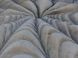 Buddha sculpture carved into the rock of a mountain
