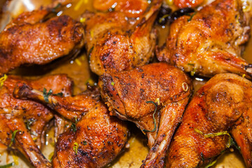 Baked duck drumsticks close up.