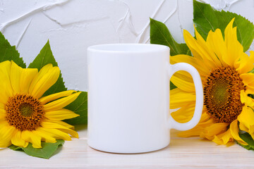 White coffee mug mockup with two yellow sunflowers