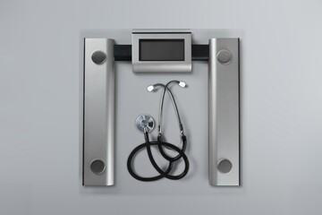 Weight scale with stethoscope, concept of correlation between weight and heart conditions
