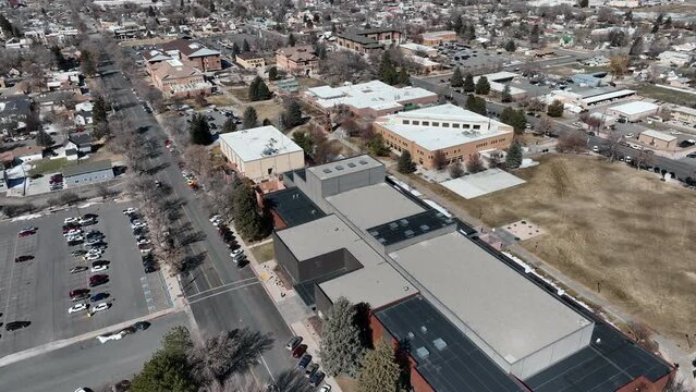 Aerial rural Snow College Ephraim Utah winter spring 1. Rural college university in Ephraim central Utah. Education, learning, sports and technical study. Early spring weather and climate. Campus.