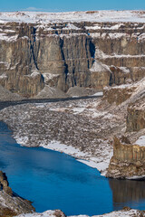 Massive deep canyon with vertical walls, vertical composition