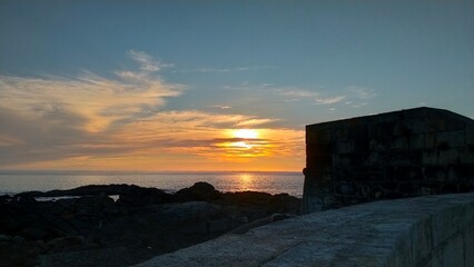 sunset over the city near the sea