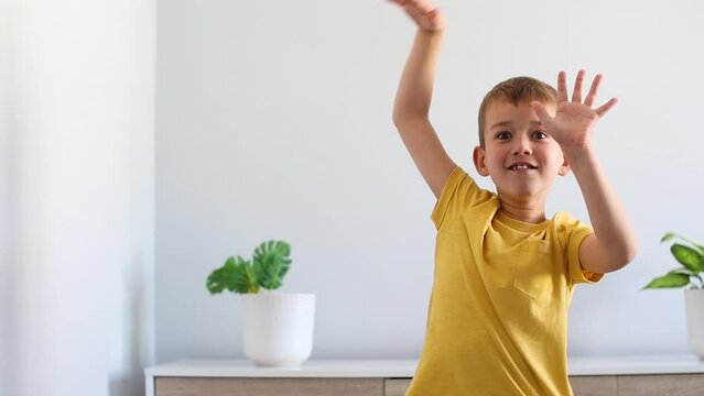 Boy doing pantomime at home. Video with copy space