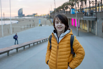 Obraz premium Cute little children tourists admiring Barcelona city, family travel with kids