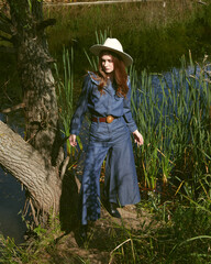 Fashion girl posing on nature redhead