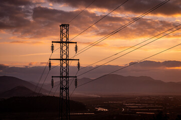 Fototapeta na wymiar High-voltage power lines. Electricity distribution station. high voltage electric transmission tower. Distribution electric substation with power lines and transformers.