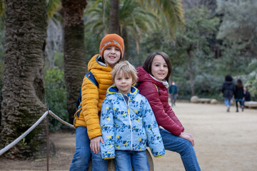 Family, children, posing in park Guell in Barcelona