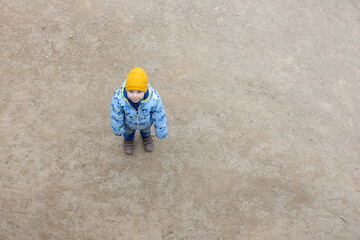 Child, cute toddler blond boy, posing in park Guell in Barcelona
