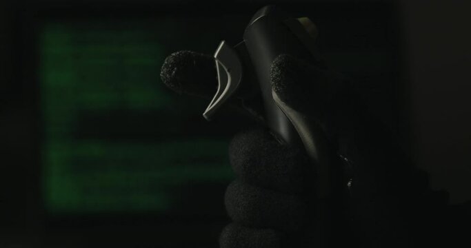 Hand of a military pilot controls a remote spy surveillance drone for warfare