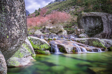 Natural swimming pools with rocks in the touristic place of Loriga, Serra da Estrela - Portugal. River pools at Loriga, Serra da Estrela - Portugal