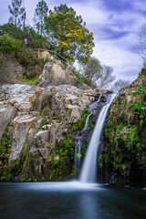 Fototapeta na wymiar Beautifull waterfall of Poço da Broca in Barriosa, municipality of Seia - Portugal. Natural Park with waterfalls in the Serra da Estrela Natural Park - Portugal