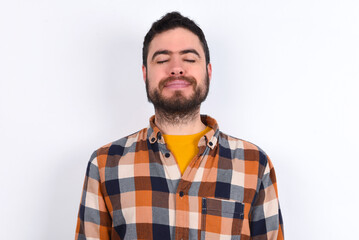 young caucasian man wearing plaid shirt over white background nice-looking sweet charming cute attractive lovely winsome sweet peaceful closed eyes