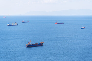 seven cargo ships waiting off the Aegean Sea