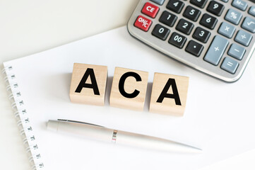 aca inscription on wooden cubes isolated on white background, medicine concept.