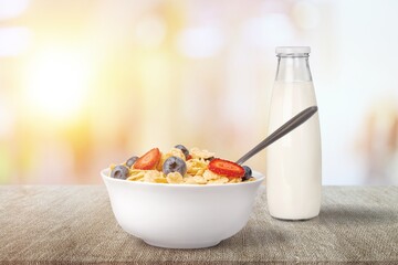 The concept of a healthy breakfast of vegetarian yogurt and fresh fruit on a table