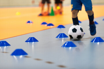 Boy in Soccer Clothes with Futsal Ball on Dribbling Drill. Kid on Indoor Soccer Training With...