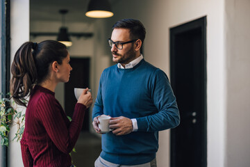 Man and woman, enjoying their coffee break