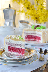 Easter cake decorated with chocolate eggs: nut biscuit, currant jelly,  cheese mousse with poppy and white chocolate glaze. Homemade baking. Gluten-free
