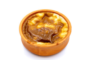 Casserole rice pudding on a white background. A delicious dessert made with rice and milk. Traditional middle eastern cuisine delicacies. local name guvec sutlac