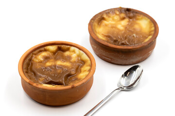 Casserole rice pudding on a white background. A delicious dessert made with rice and milk. Traditional middle eastern cuisine delicacies. local name guvec sutlac