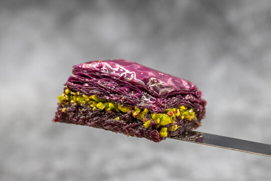 Pistachio Purple baklava (violet baklava). Traditional Middle Eastern Flavors. Local name Mor Baklava. close up.