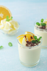 Orange lemon citrus milk mousse in glasses	