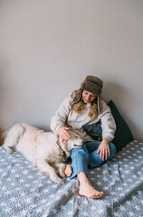 Portrait of a woman and her life-style labrador retriever at home