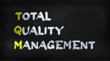 TOTAL QUALITY MANAGEMENT(TQM) on chalkboard