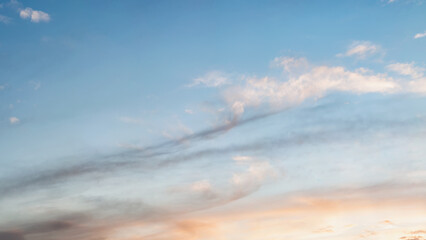Panorama of the sky at sunset, light clouds and a color gradient. evening sky