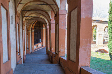 Beautiful streets of Bologna in the morning, arcaded streets with columns